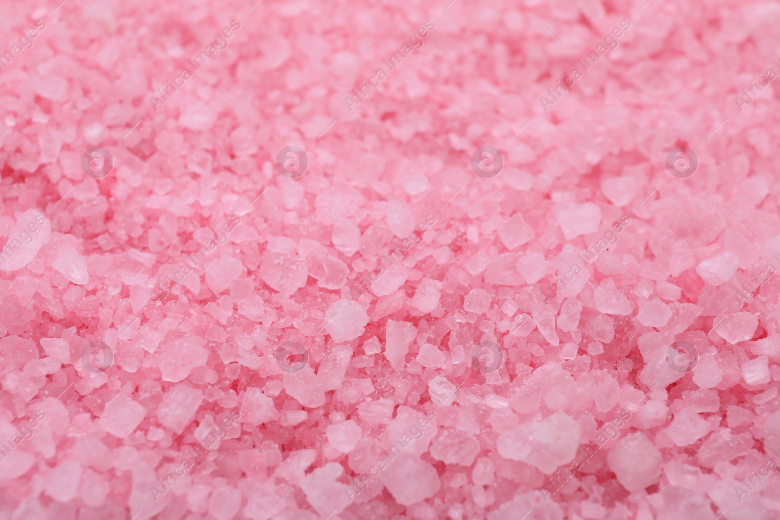 Photo of Pink sea salt as background, closeup view