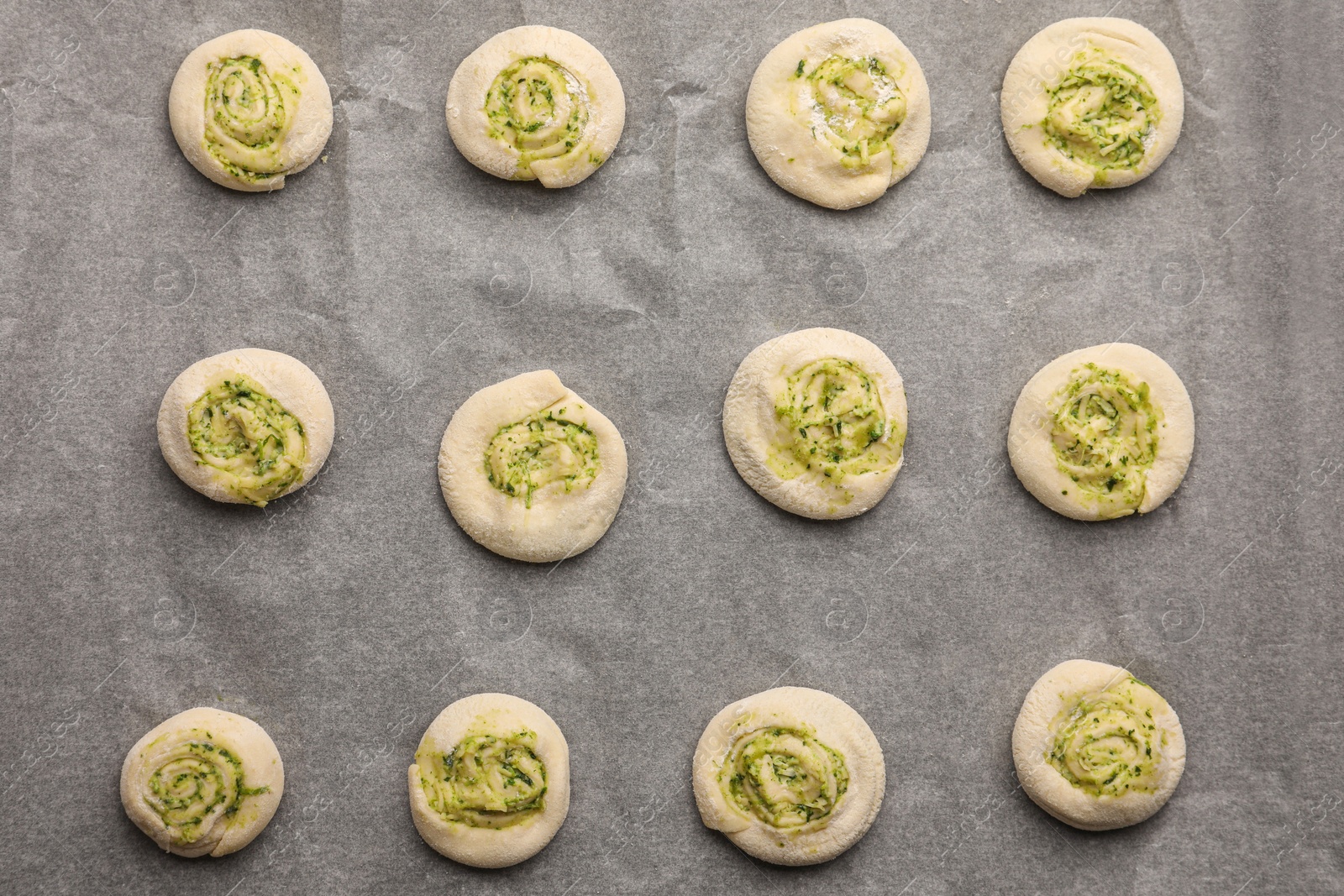 Photo of Raw puff pastry with tasty filling, top view