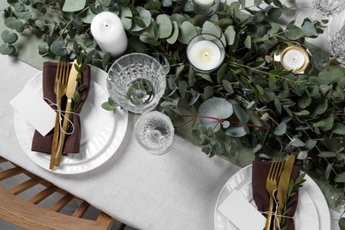 Photo of Luxury table setting with beautiful decor and blank cards. Festive dinner