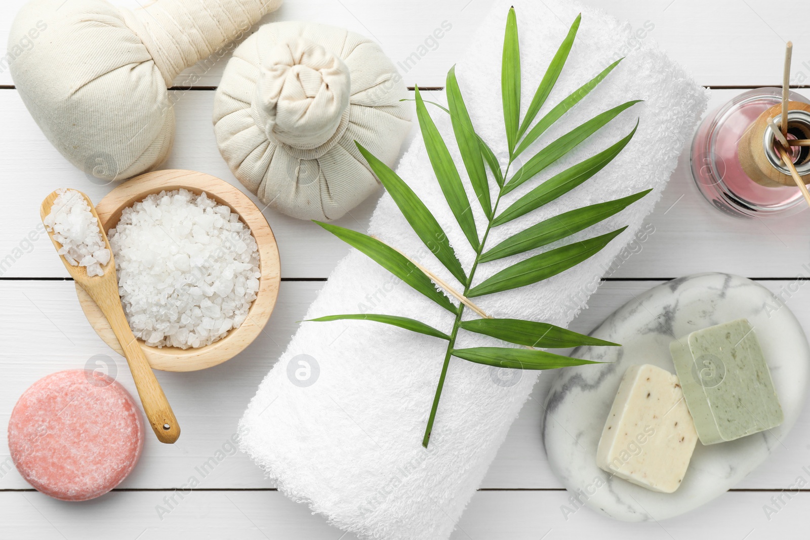 Photo of Flat lay composition with different spa products on white wooden table