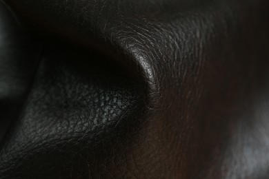 Texture of black leather as background, closeup