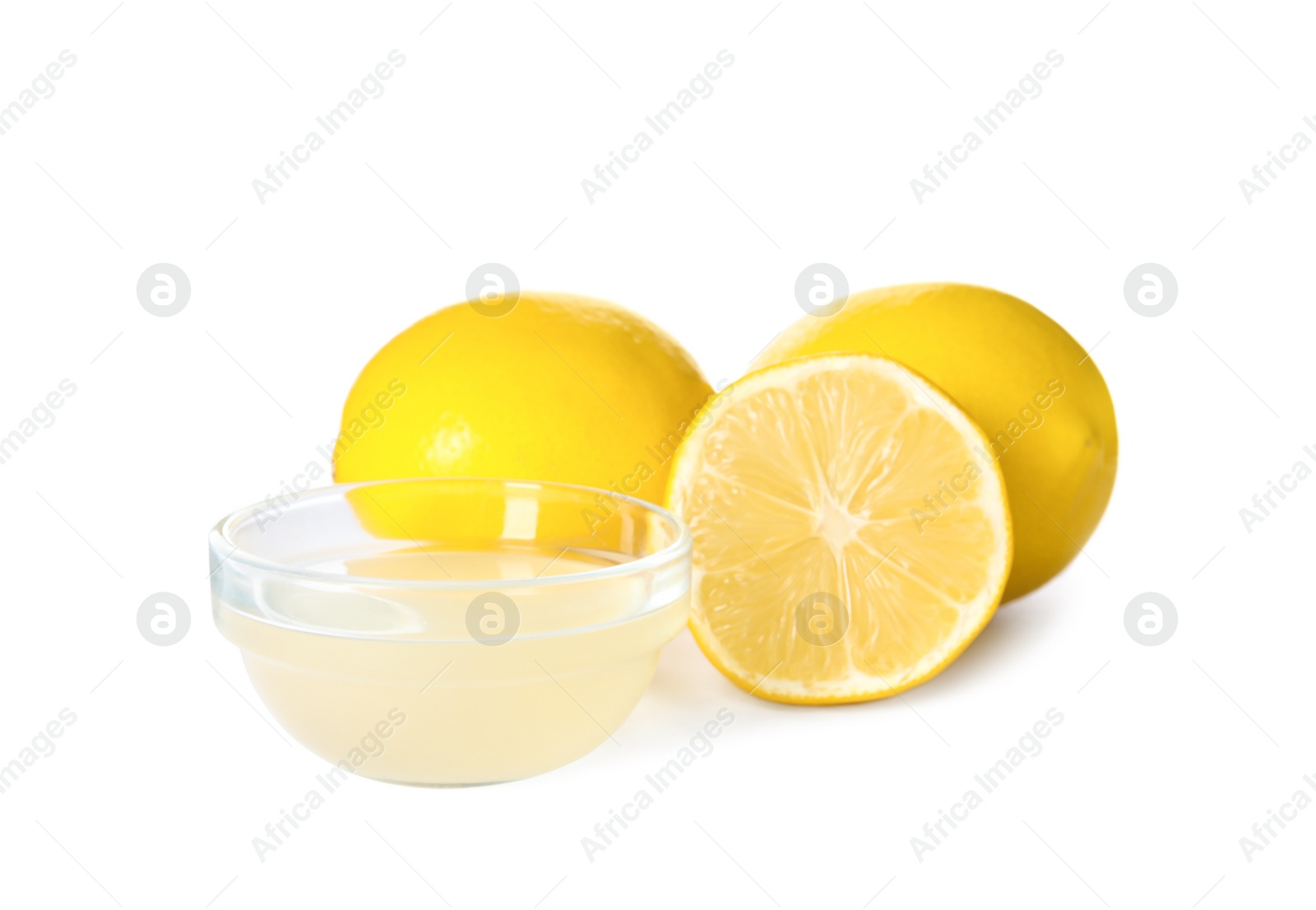 Photo of Freshly squeezed juice and lemons on white background