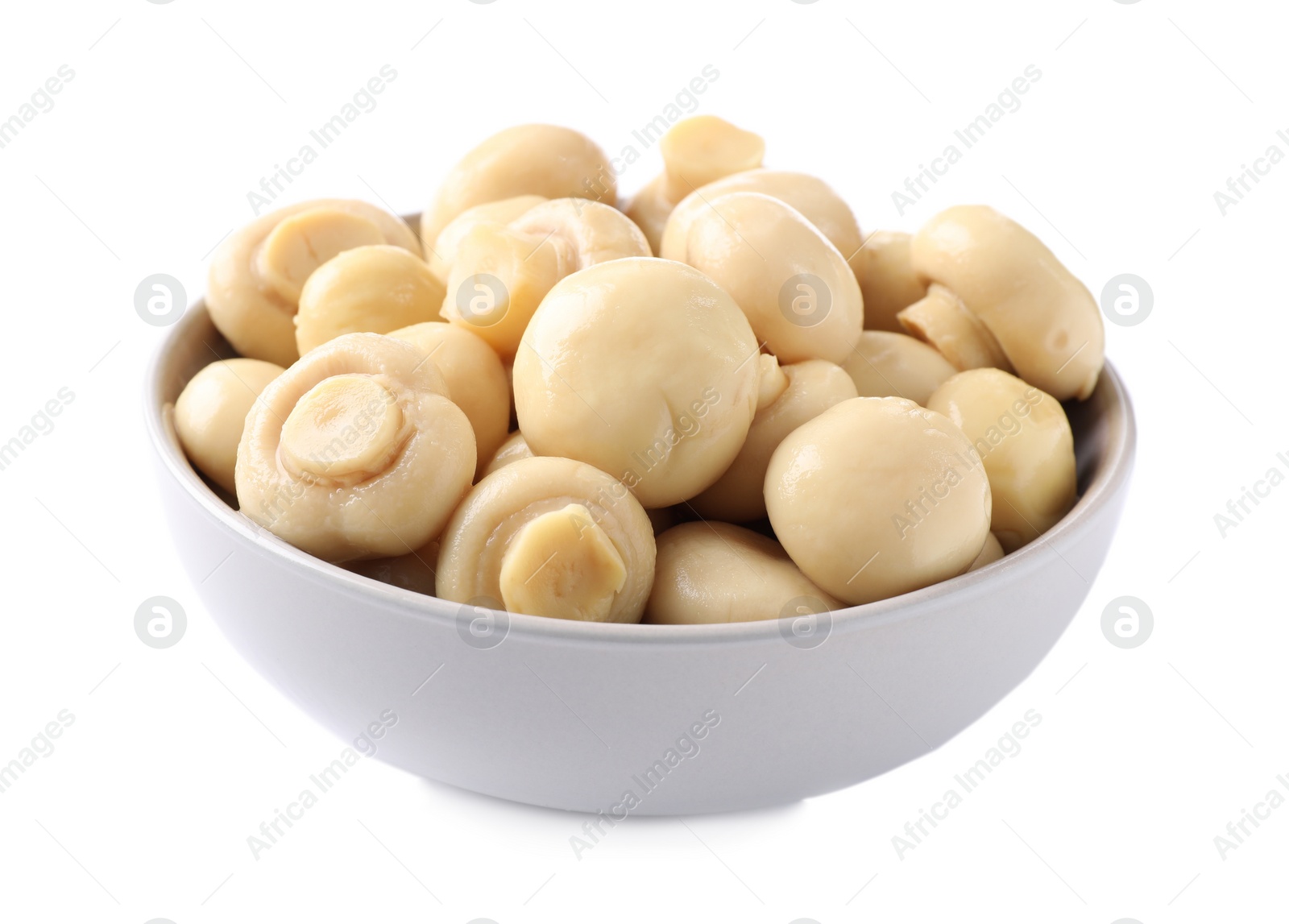 Photo of Tasty marinated mushrooms in bowl isolated on white