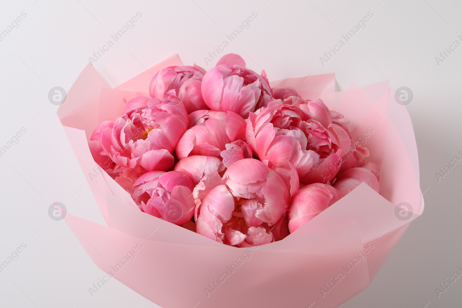 Photo of Bouquet of beautiful pink peonies on white background