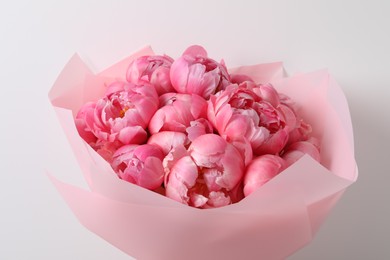 Photo of Bouquet of beautiful pink peonies on white background