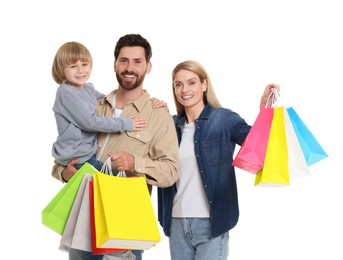 Family shopping. Happy parents and son with many colorful bags on white background