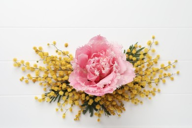 Photo of Beautiful floral composition with mimosa flowers on white wooden background, flat lay