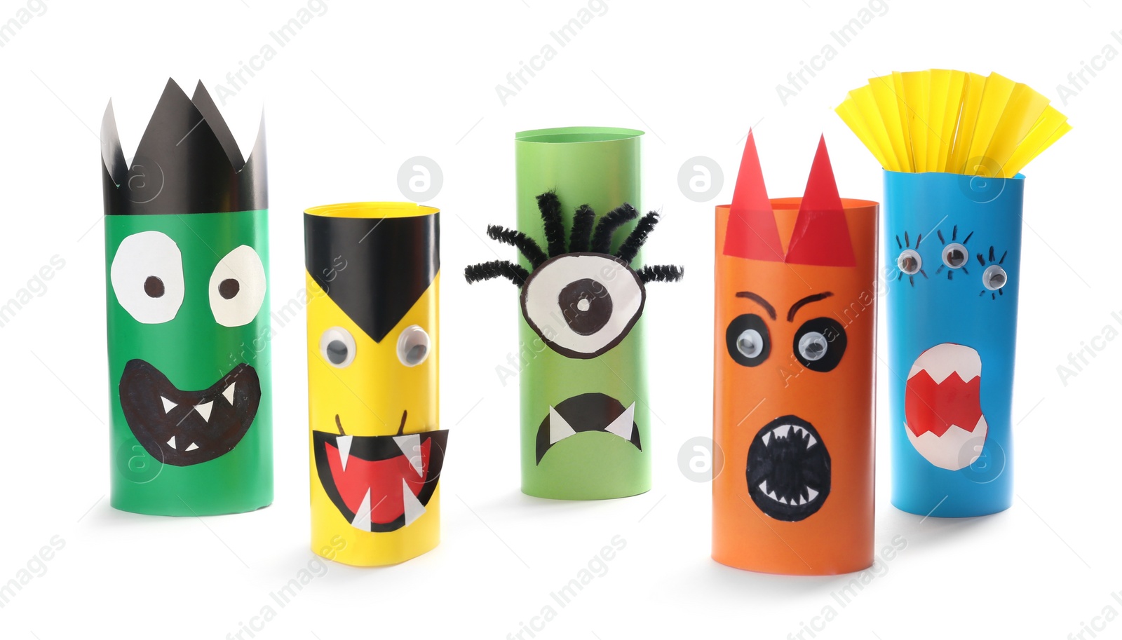 Photo of Funny monsters on white background. Halloween decoration