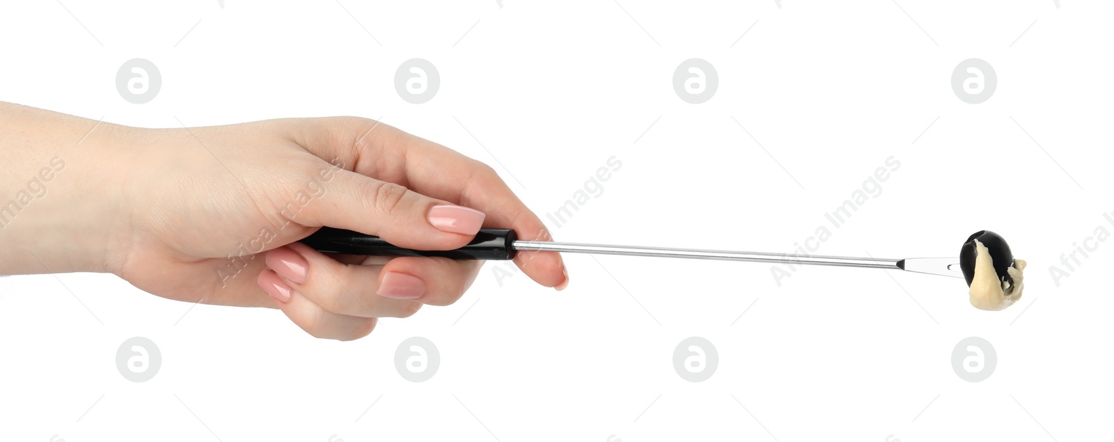 Photo of Tasty fondue. Woman holding fork with olive and melted cheese on white background, closeup