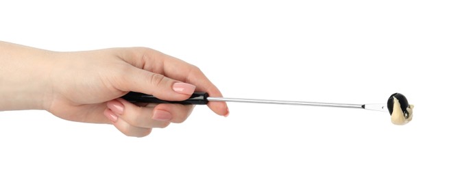 Photo of Tasty fondue. Woman holding fork with olive and melted cheese on white background, closeup