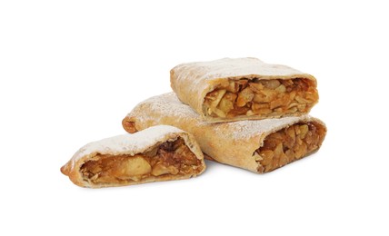 Delicious cut strudel with apples, nuts and raisins isolated on white