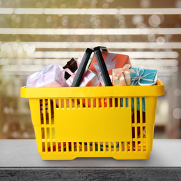 Boxing day concept. Shopping basket with gifts in supermarket