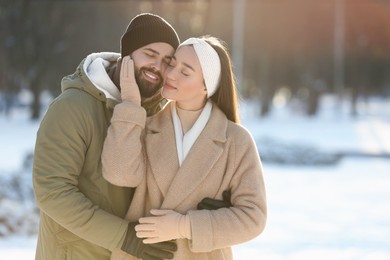 Photo of Beautiful young couple enjoying winter day outdoors