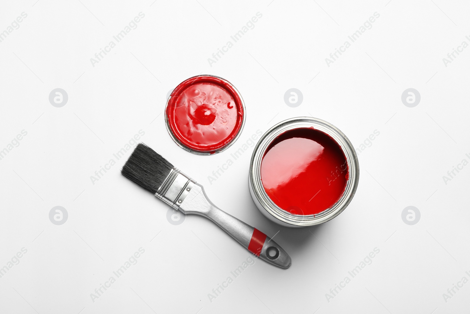 Photo of Paint can and brush on white background, top view