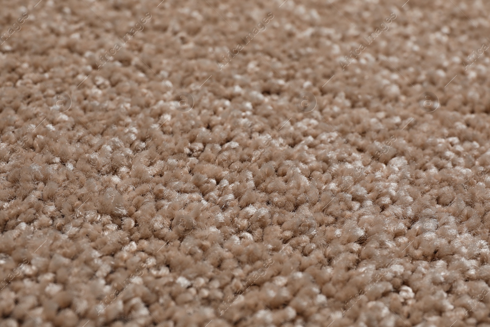 Photo of Fuzzy carpet texture as background, closeup view