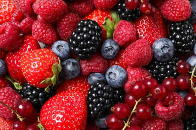 Different fresh ripe berries as background, top view