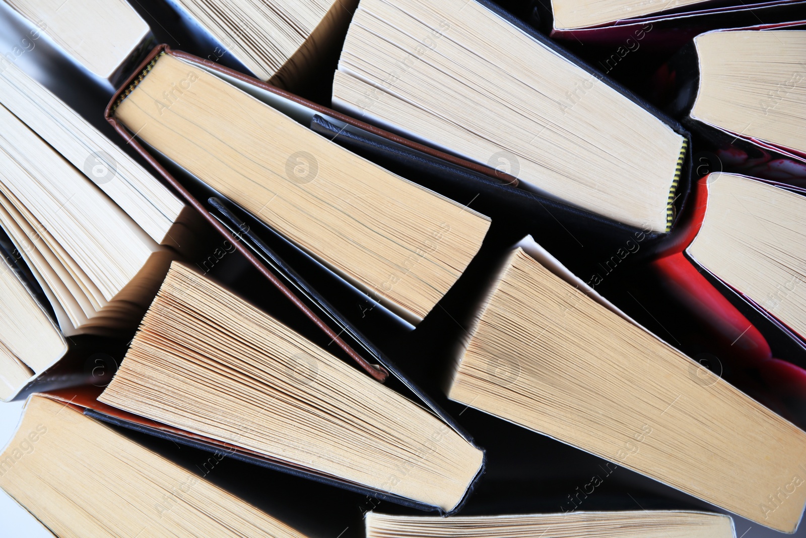 Photo of Collection of different books as background, top view