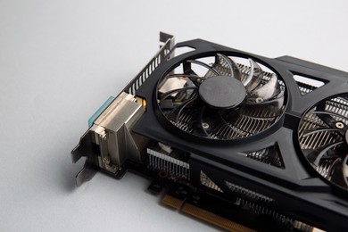 Photo of One graphics card on color background, closeup