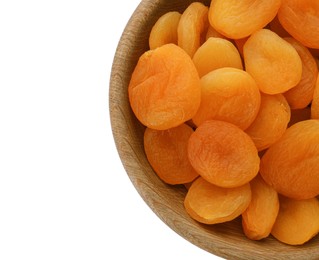 Photo of Wooden bowl with dried tasty apricots isolated on white, top view