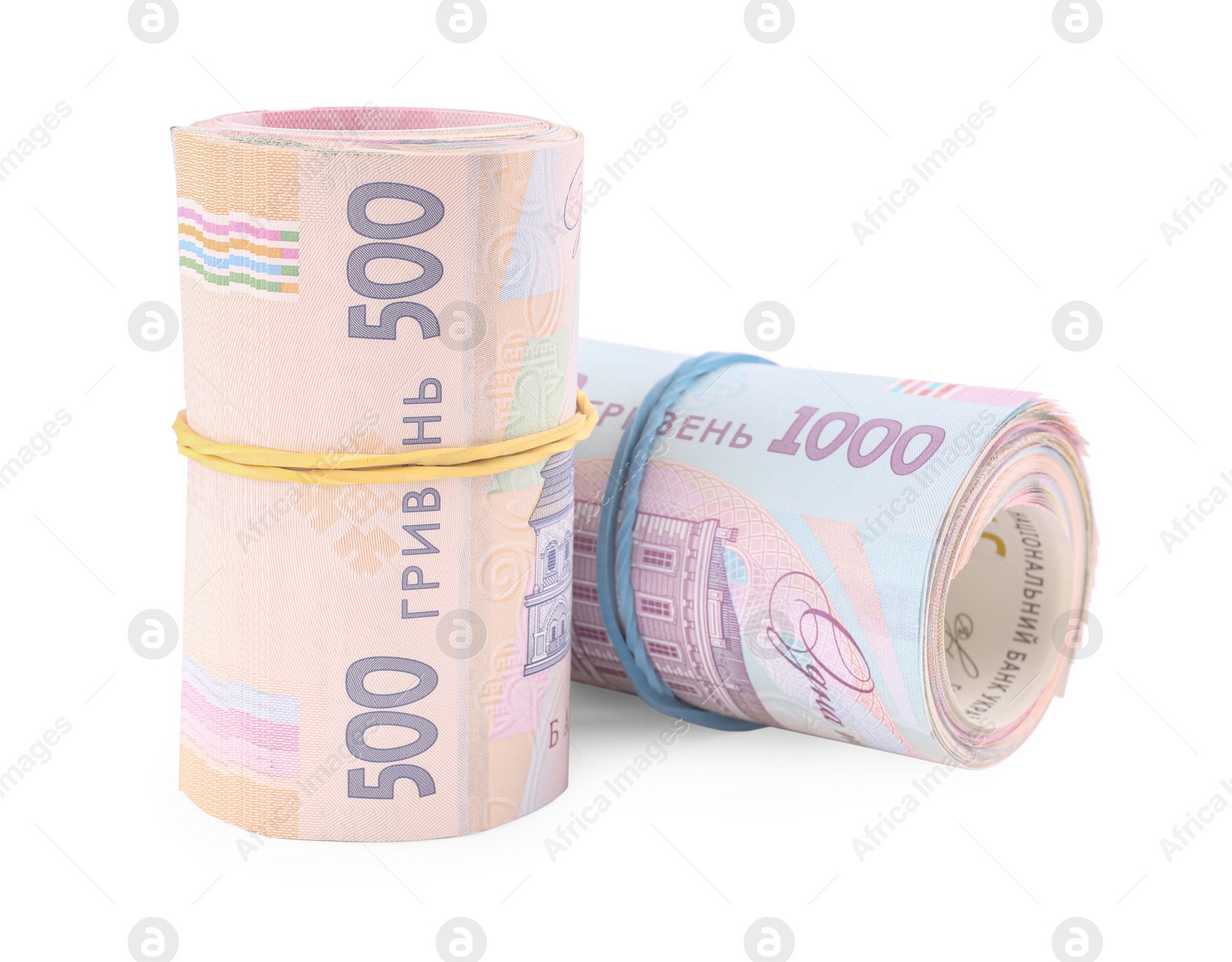 Photo of Rolls of Ukrainian money on white background