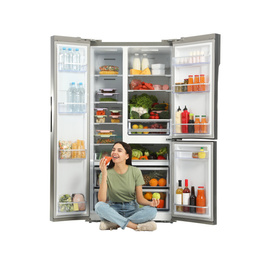 Photo of Young woman with apple and sausage near open refrigerator on white background