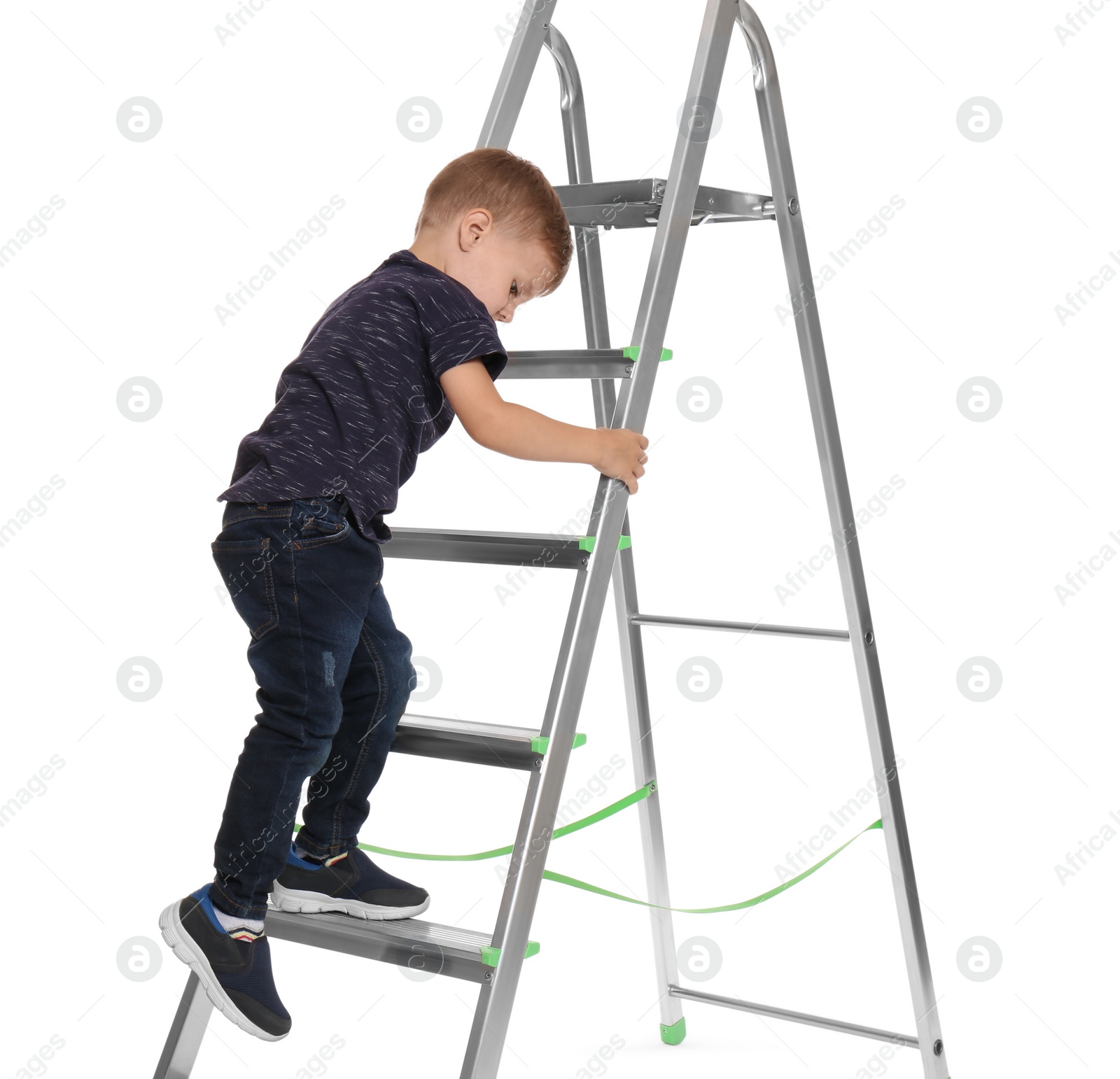 Photo of Little child climbing up ladder on white background. Danger at home