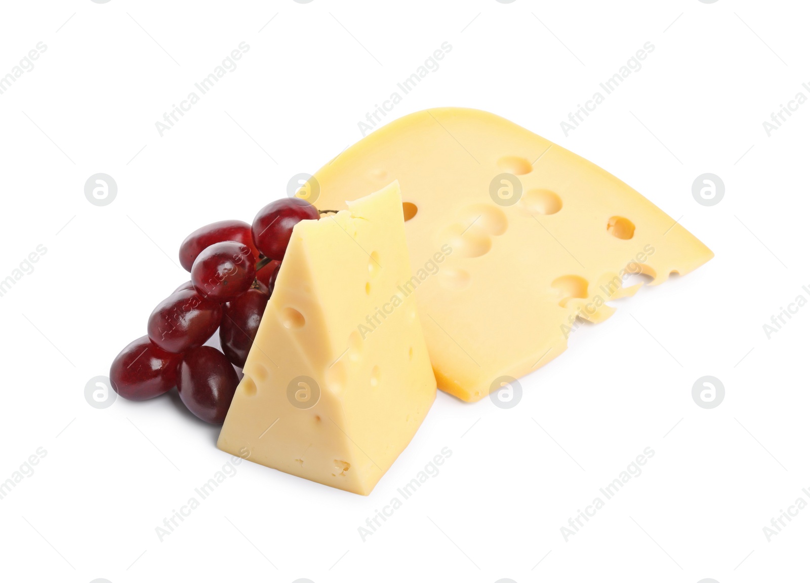 Photo of Pieces of delicious cheese and grapes isolated on white