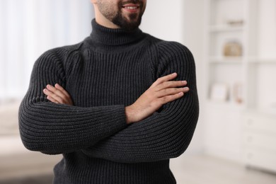 Photo of Man in stylish sweater at home, closeup
