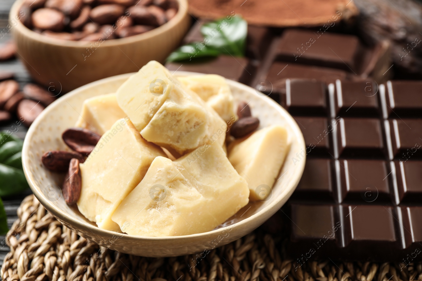 Photo of Aromatic organic cocoa butter on table, closeup