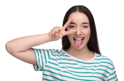 Photo of Happy woman showing her tongue and V-sign on white background