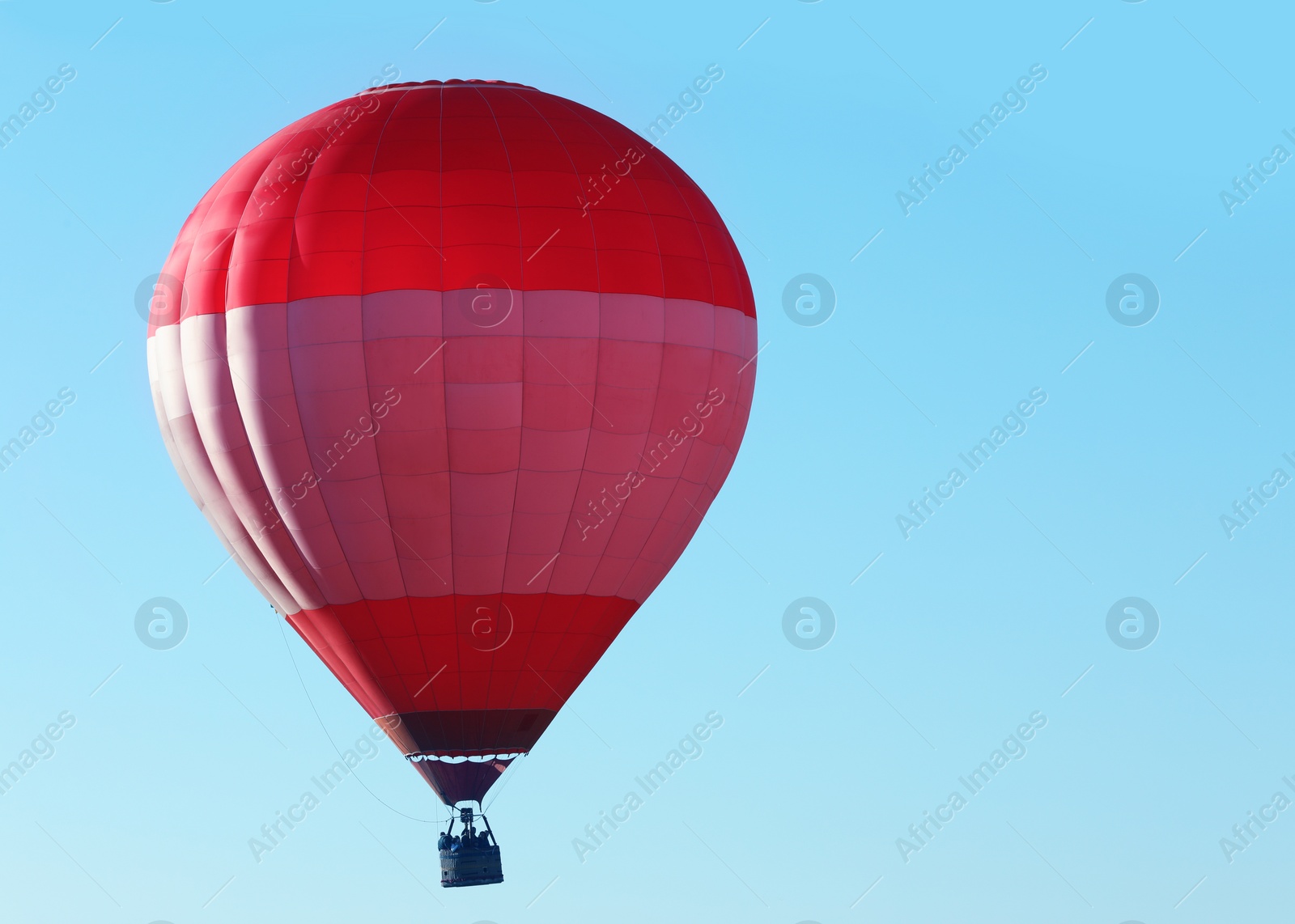 Photo of Beautiful view of hot air balloon in blue sky. Space for text