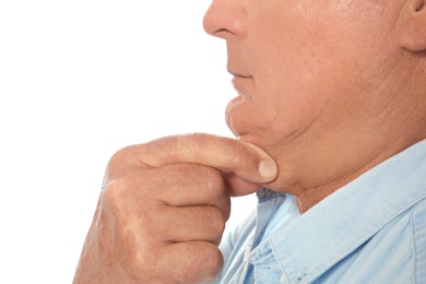 Mature man with double chin on white background, closeup