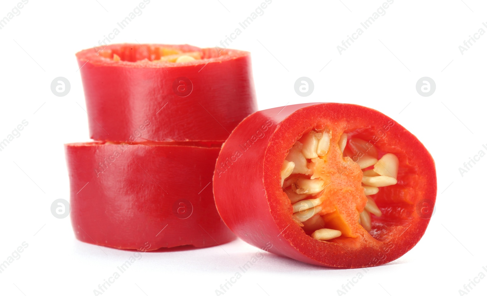 Photo of Slices of red chili pepper on white background