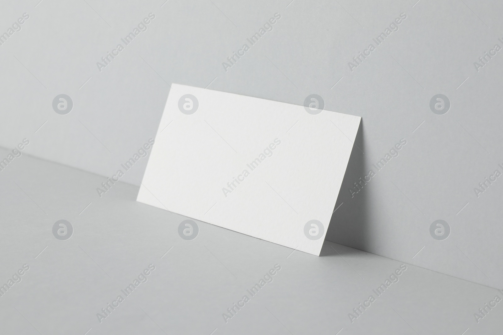 Photo of Blank business card on light grey background. Mockup for design