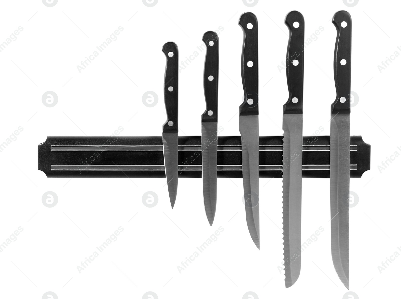 Photo of Magnetic holder with different knives isolated on white