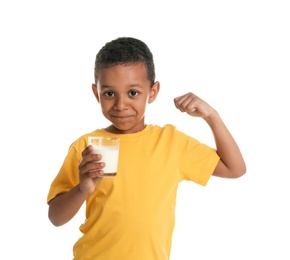 Adorable African-American boy with glass of milk on white background