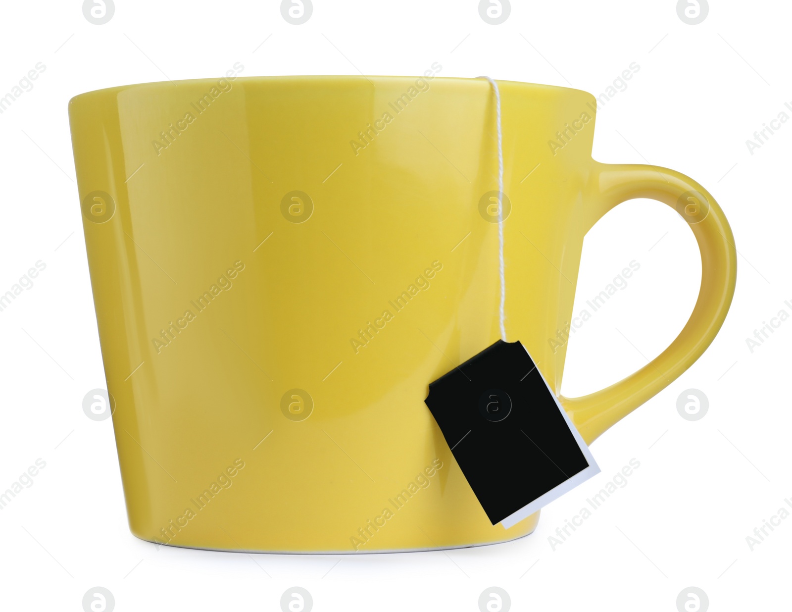 Photo of Yellow cup with teabag isolated on white