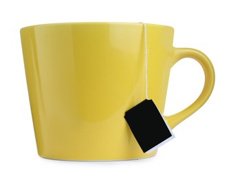 Yellow cup with teabag isolated on white