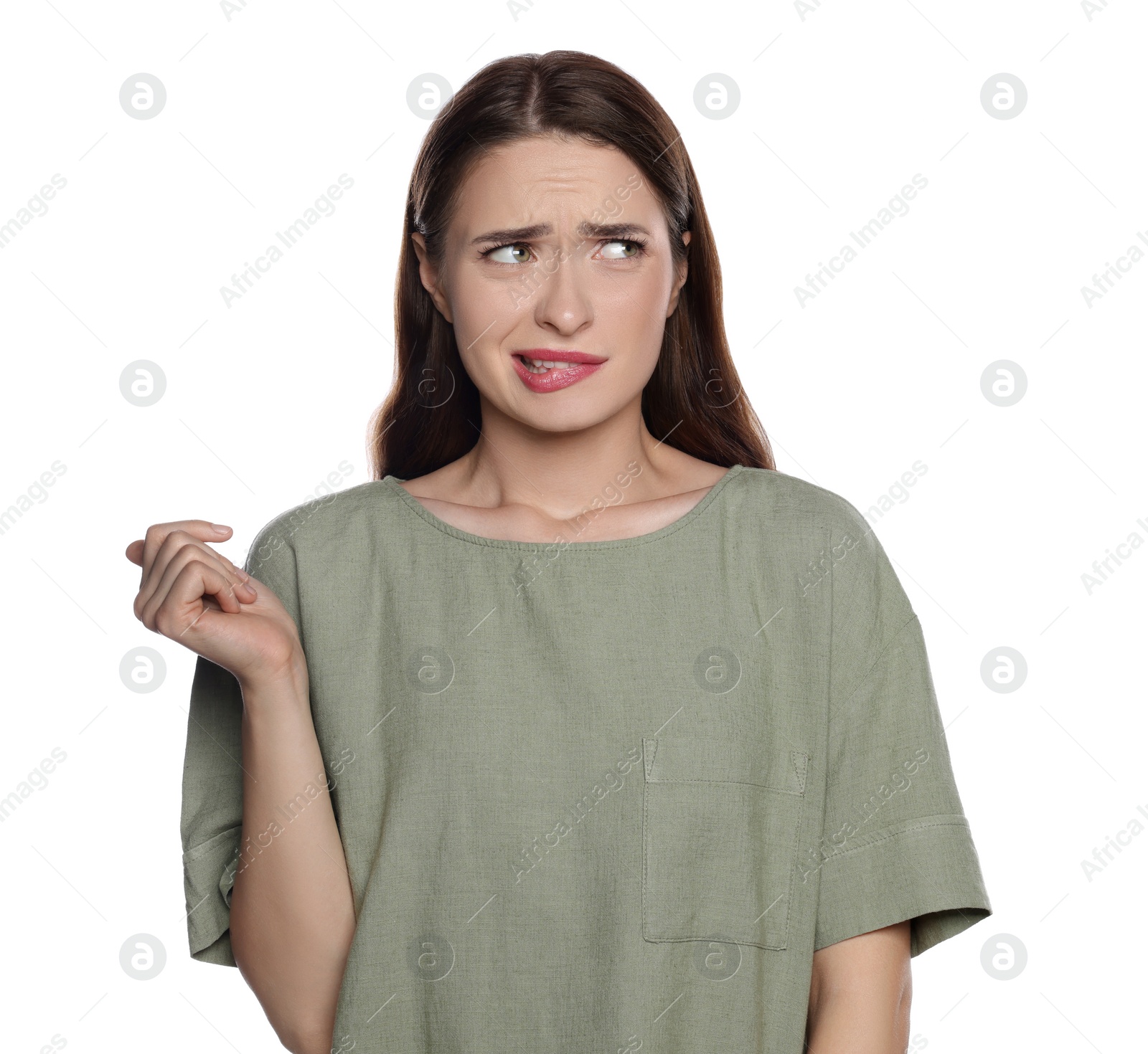 Photo of Embarrassed young woman in shirt on white background