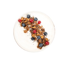 Delicious yogurt with granola and berries in bowl isolated on white, top view