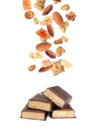 Tasty chocolate glazed protein bars and granola with almonds and dried fruits falling on white background