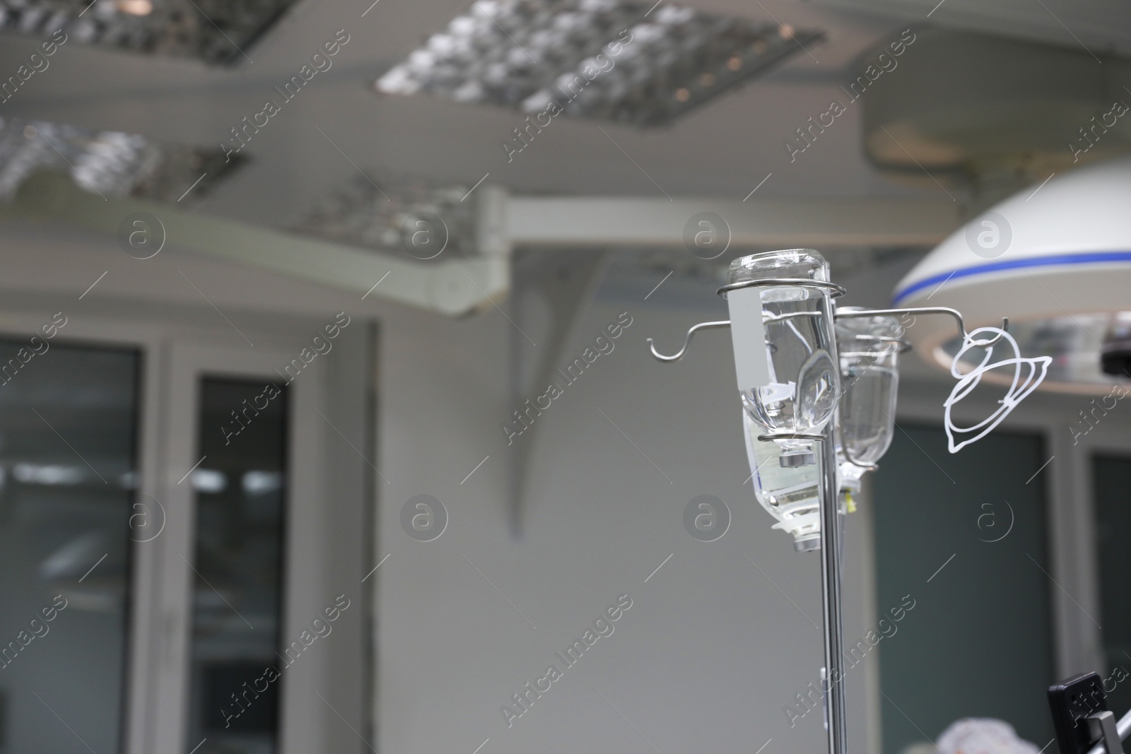 Photo of Rack with bottles of drugs in operating room