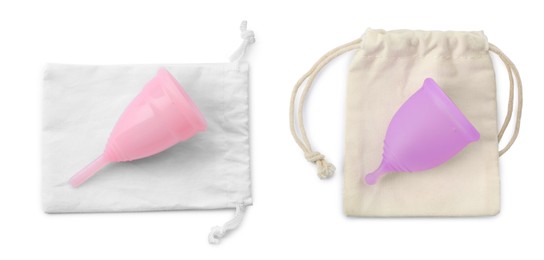 Menstrual cups and cotton bags on white background, top view. Banner design