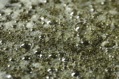 Photo of Melting butter in frying pan, closeup view