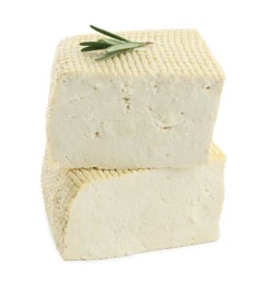 Photo of Pieces of delicious tofu and rosemary on white background. Soybean curd
