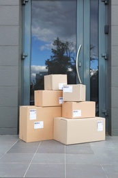 Photo of Stack of parcel boxes on floor near entrance