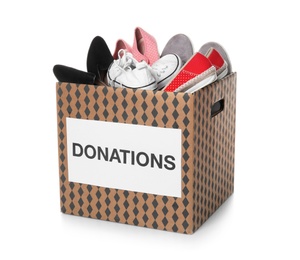 Photo of Donation box with shoes on white background