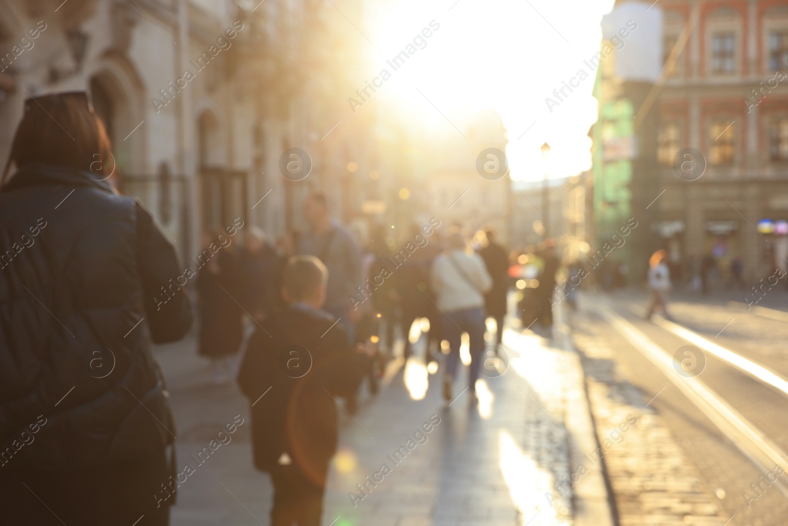 Photo of Blurred view of people walking on city street