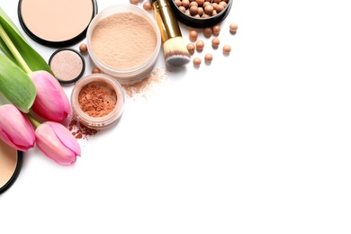 Photo of Many different makeup products and spring flowers on white background, top view