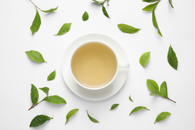Photo of Flat lay composition with green tea on white background